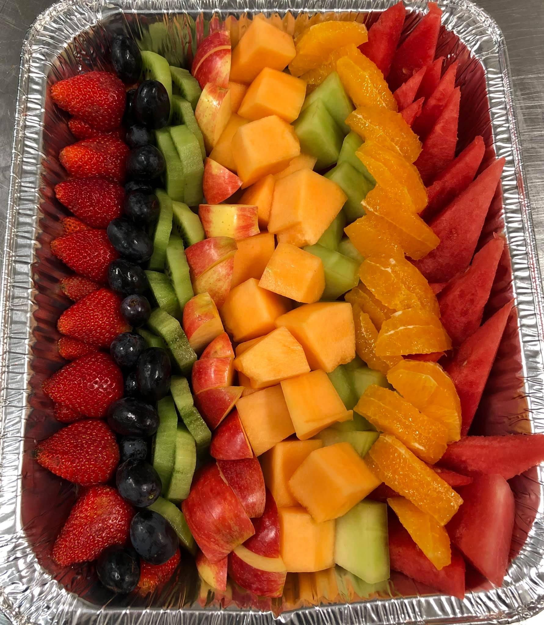 Another fresh fruit platter, artfully arranged with diverse fruits.